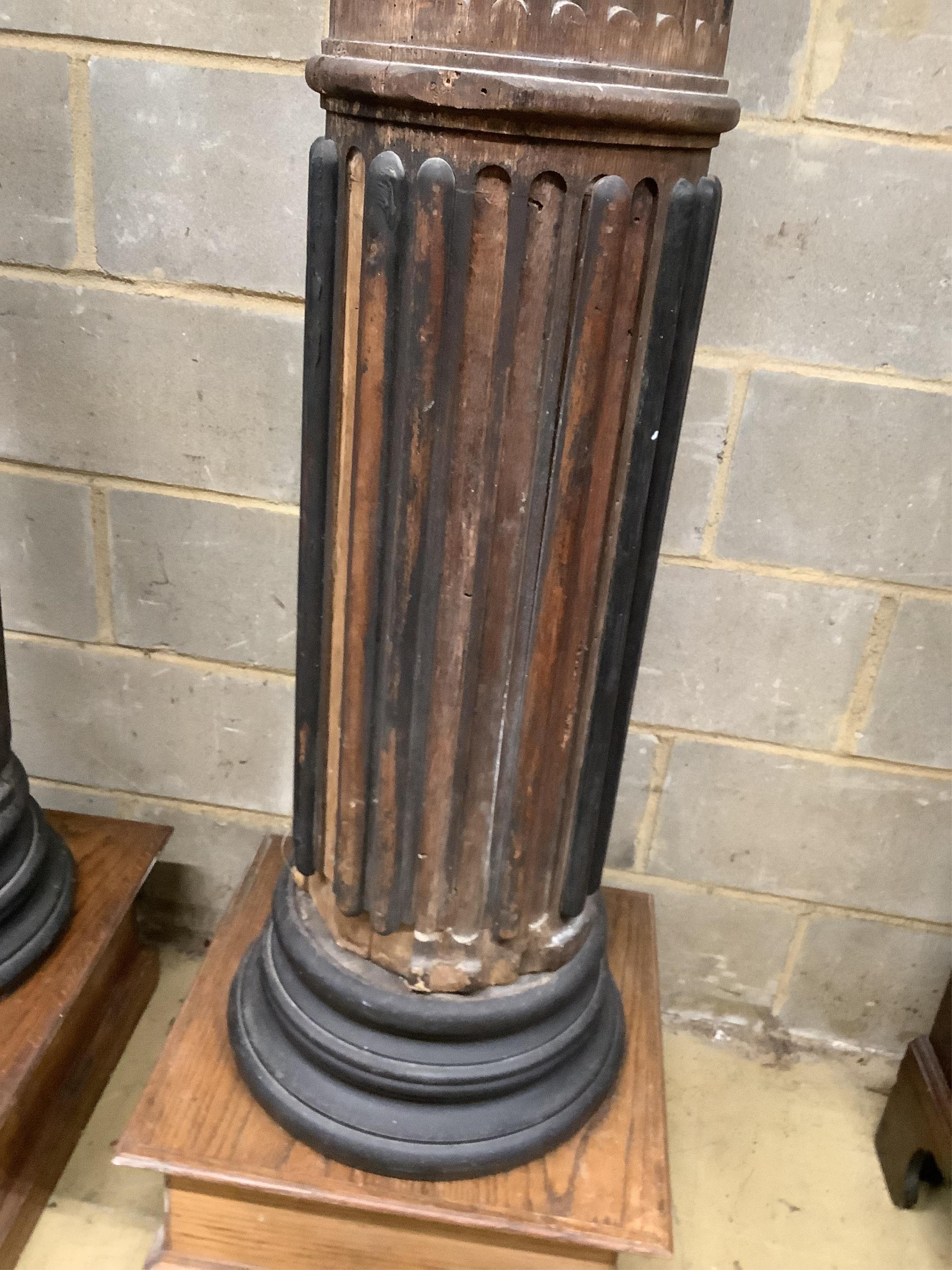 A pair of 17th century oak Corinthian columns, of large size, height 279cm, by repute from St Mary le Bow, designed by Christopher Wren